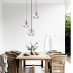 suspension lumineuse moderne transparent doré rayures verticales câble noir ampoules