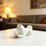 statue chien couché livre ouvert blanc noir décoration intérieur 10cm longueur 5cm hauteur festive