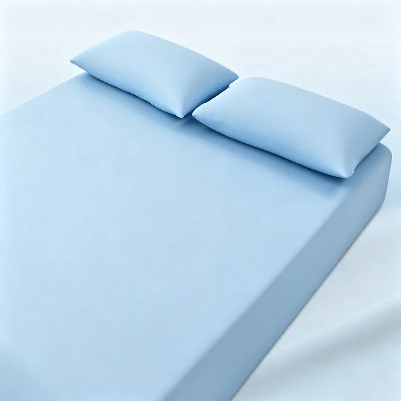 parure lit bleu clair drap housse élastique deux oreillers coton doux chambre moderne