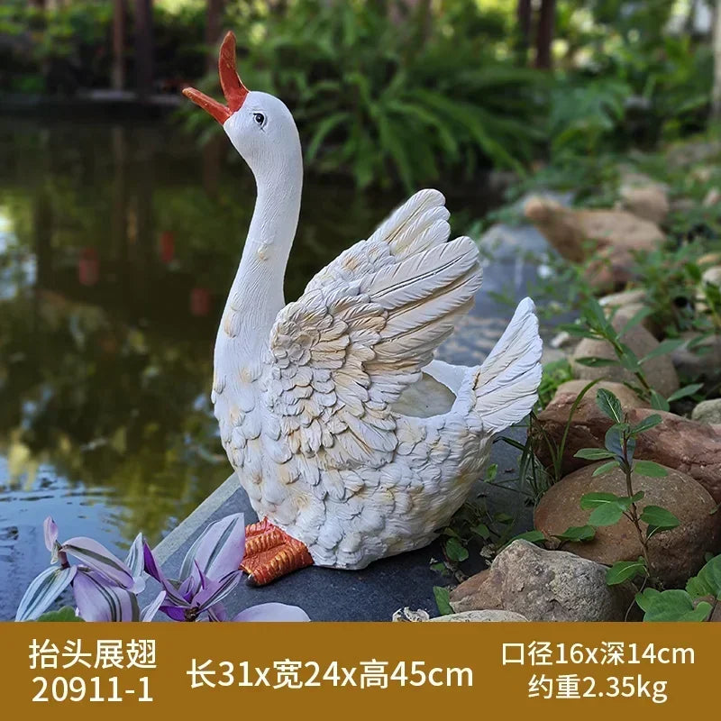 statue canard blanc plumes orange piscine jardin décoration extérieure animaux ornements paysagistes fleurs artificielles