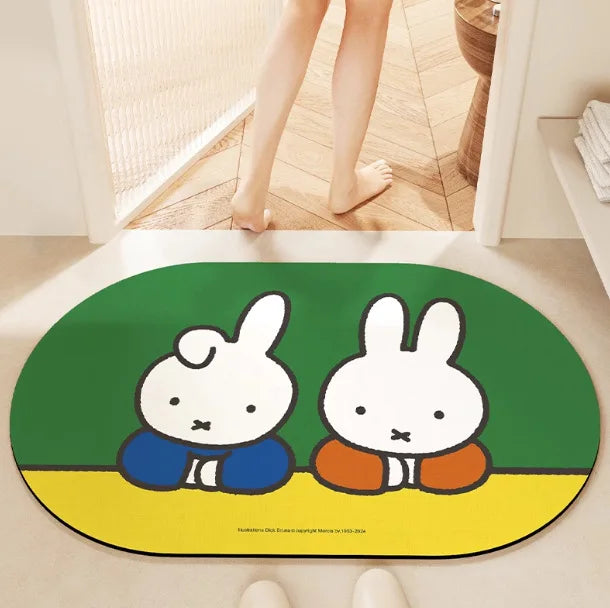 tapis bain dessin animé lapins gris jaune vert bleu rayures enfantin absorbant