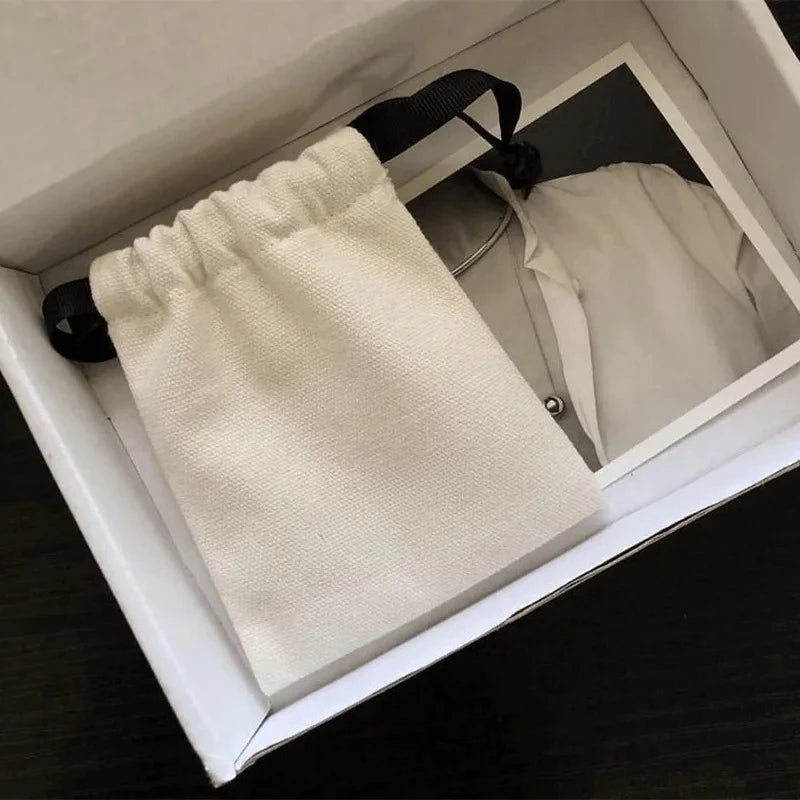 sac bijoux toile coton fleuri ruban noir beige clair minimaliste réutilisable personnalisable logo imprimé