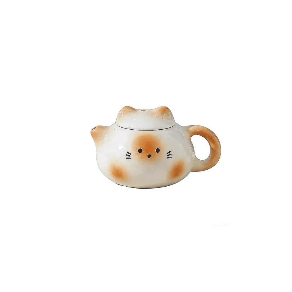 théière forme chat blanc rose vert jaune yeux noirs oreilles roses poils blancs décoration