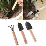 ensemble jardinage outils pelle houe brosse sac semis arrosoir pot fleurs vert noir moderne