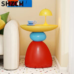 table basse ronde pierre moderne minimaliste sculptural couleur vive salon