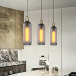suspension lumineuse moderne gris fumé doré verre mat métal poli ampoule filament visible chambre