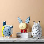 figurines decoratives modernes enfants couleurs vives motifs points textures lisses deco maison exposition