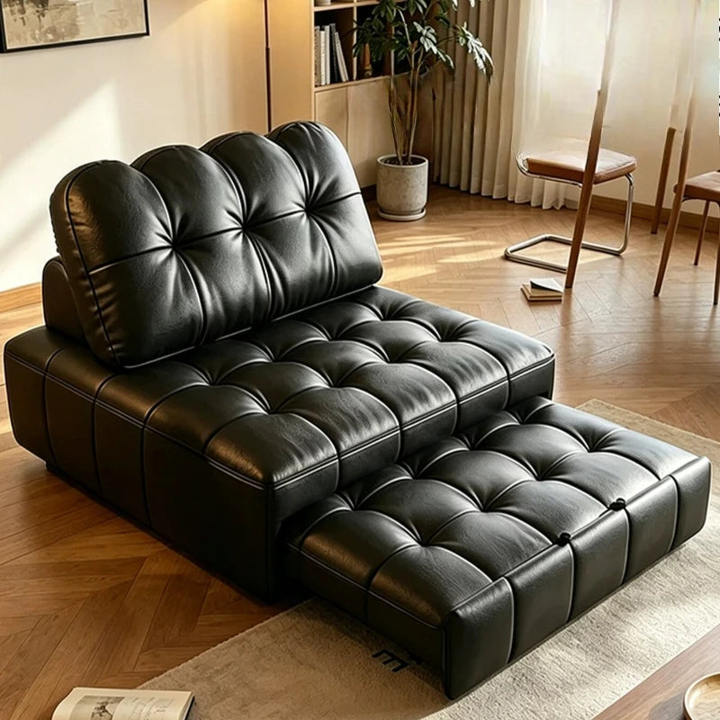 canapé lit noir moderne scandinave capitonné oreiller couverture salon luxe