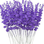 bouquet artificiel feuilles vertes naturel minimaliste ruban blanc vase blanc tapis beige ornement extérieur