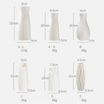 vases blancs modernes rayures horizontales rose pâle vert clair décoration intérieure minimalistes