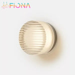 Détail de l'applique murale LED ronde avec lumière blanche chaude