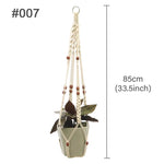support plante suspendu macramé boho artisanal blanc beige orange tissé oeilletsextérieur exposition arbres