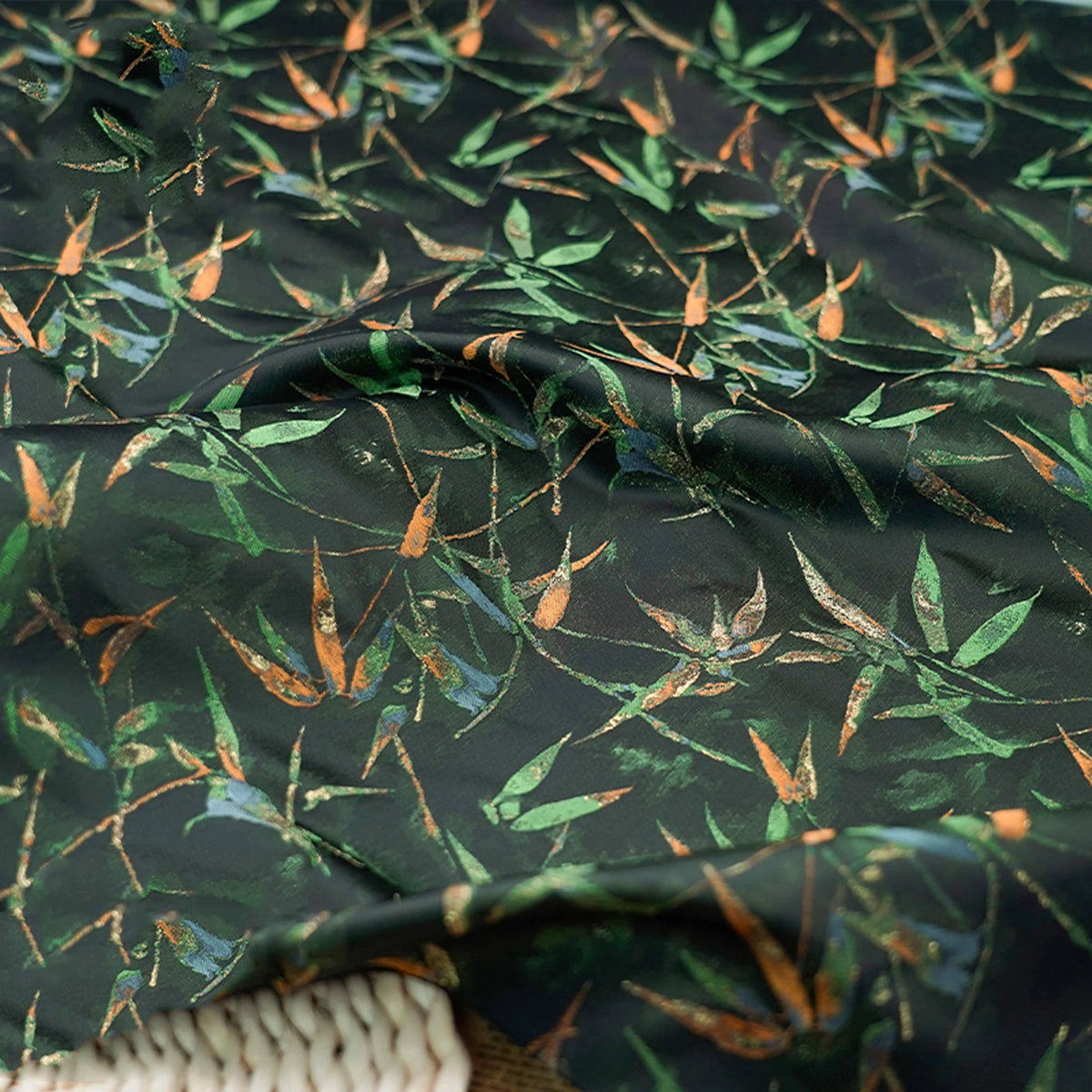tissu imprimé feuilles bambou noir vert orange respectueux environnement largeur 165cm opacité decoration interieur