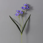 décoration intérieure bouquet artificielle orchidée blanc bleu rose feuilles verte moderne minimaliste
