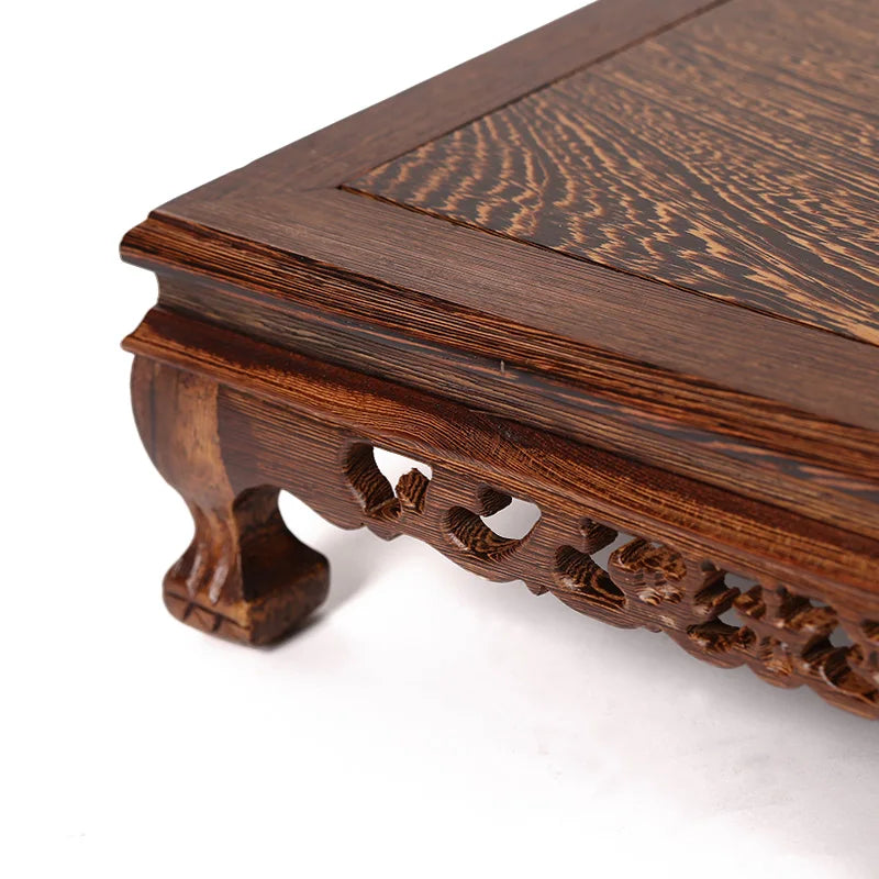 table basse bois sculptée asiatique traditionnel motifs animaux pieds decoration marron foncé rouleau papier