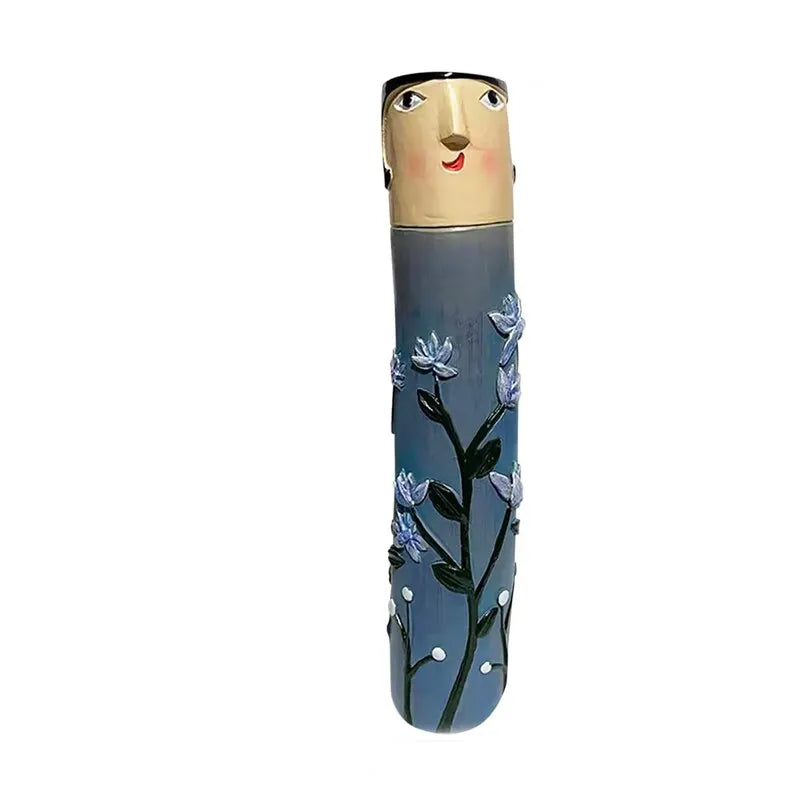 vases résine personnages fleurs stylisées vert bleu gris artisanal moderne salon décoration