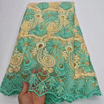 tissu dentelle brodée sequins dorés florals jaune vert rose rouge translucent traditionnel erotique echangiste