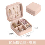 boîte rangement bijoux simili cuir vert clair rose pâle noir moderne pratique fermeture glissière