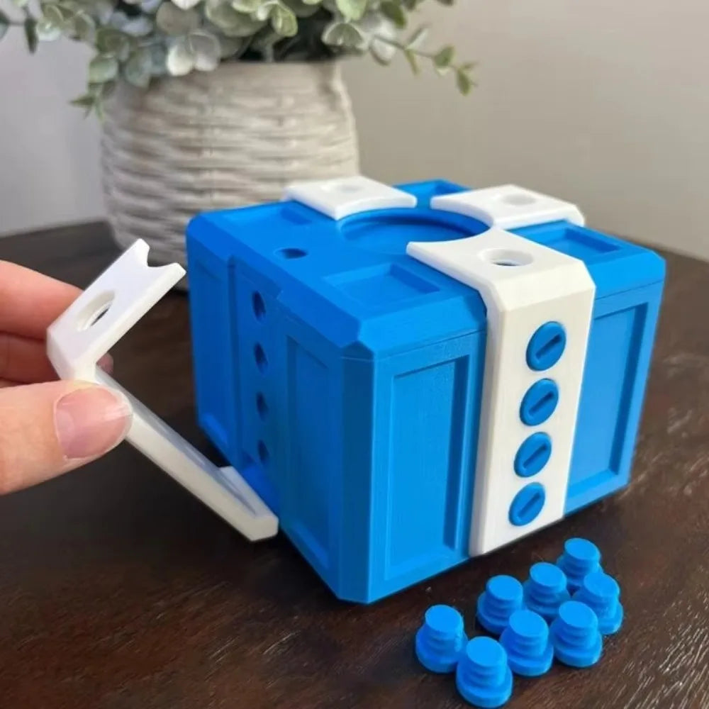boîte cadeau moderne bleu rouge clips boutons dorés jeu farces