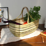 panier rangement vert clair tissé motifs géométriques rustique poignées tressées fruits légumes traditionnel
