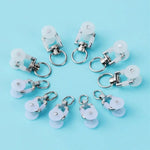 rouleaux rideaux blancs anneaux métalliques modernes quincailleries fixations poulies tringles curseurs roues mat inoxydables