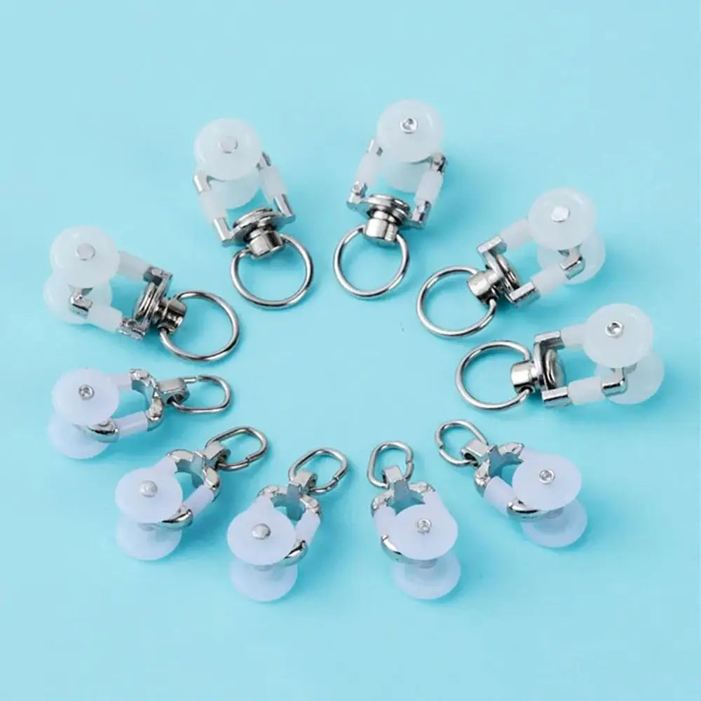 rouleaux rideaux blancs anneaux métalliques modernes quincailleries fixations poulies tringles curseurs roues mat inoxydables