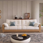 canapé lit moderne bois tissu uni beige inclinable coussins décoratifs salon minimaliste