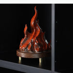 sculpture moderne flamme rouge brillante effet métallique pied bois doré
