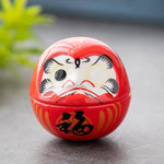 décoration table céramique daruma dolls visage stylisé motifs floraux traditionnel japonais couleur rose bleu