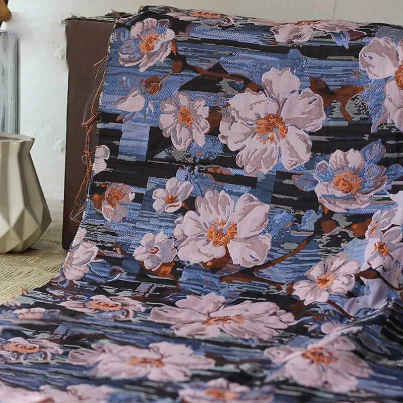 tissu imprimé fleurs blanches orange fond bleu noir résistant bricolage couture rétro 145cm