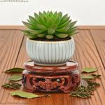 support bois sculpté motifs floraux artisanal decor maison marron foncé tranchant deco vase pot