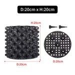 grille drainage plante noir moderne perforations circulaires différentes tailles incluses