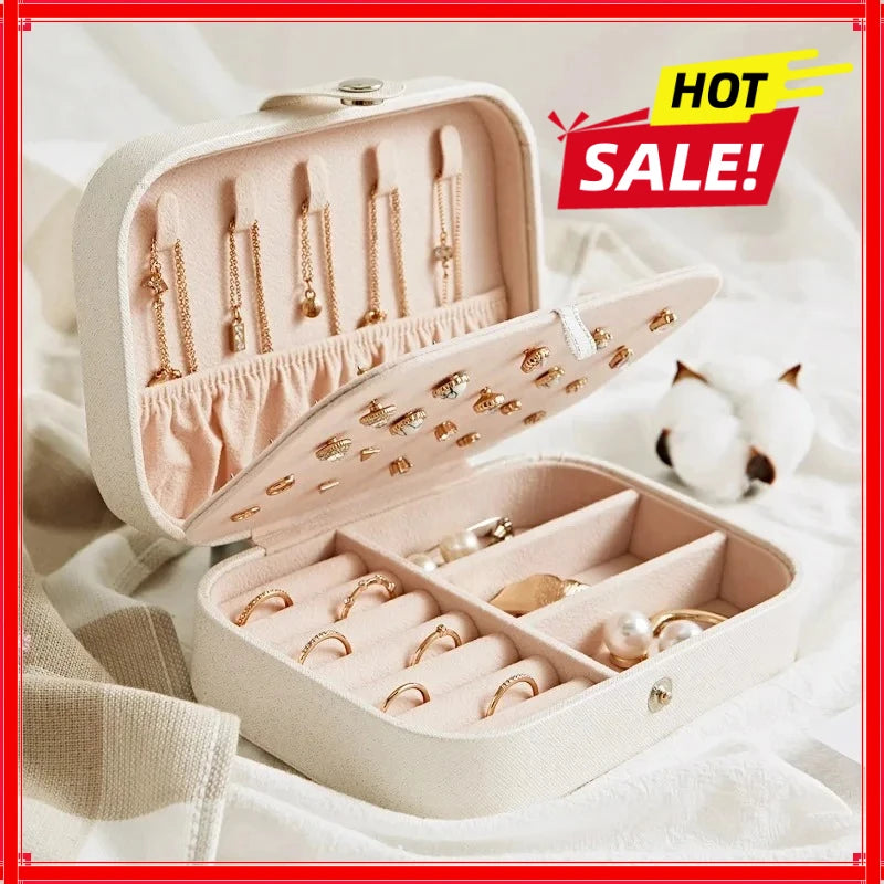 boîte bijoux moderne velours beige cuir bleu rose compartiments élégants portables voyage