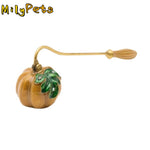 bougie parfumée suspension citrouille classique vintage orange vert bleu doré motifs feuilles tringle