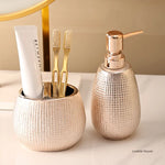 Distributeur de savon céramique or rose design moderne