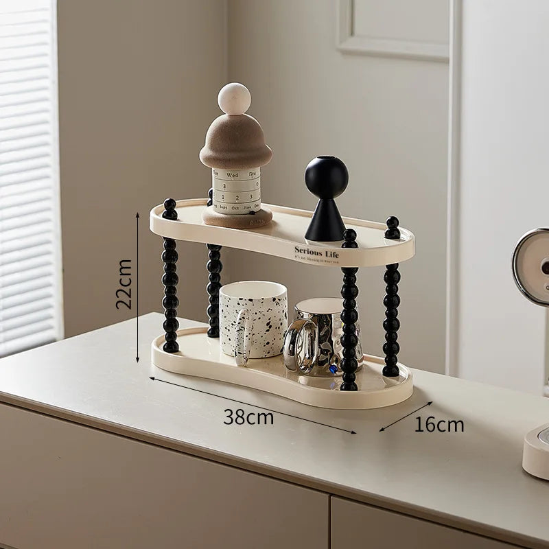 étagère trois niveaux moderne minimaliste blanc noir cosmétiques parfums tasses blancs