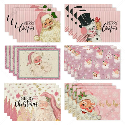 Set de 4 napperons de Noël roses à rayures avec motif Père Noël sur table