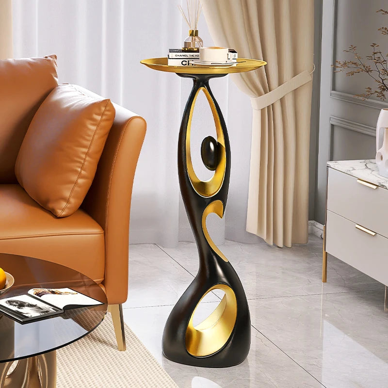 table basse moderne artistique plateau rond noir or blanc