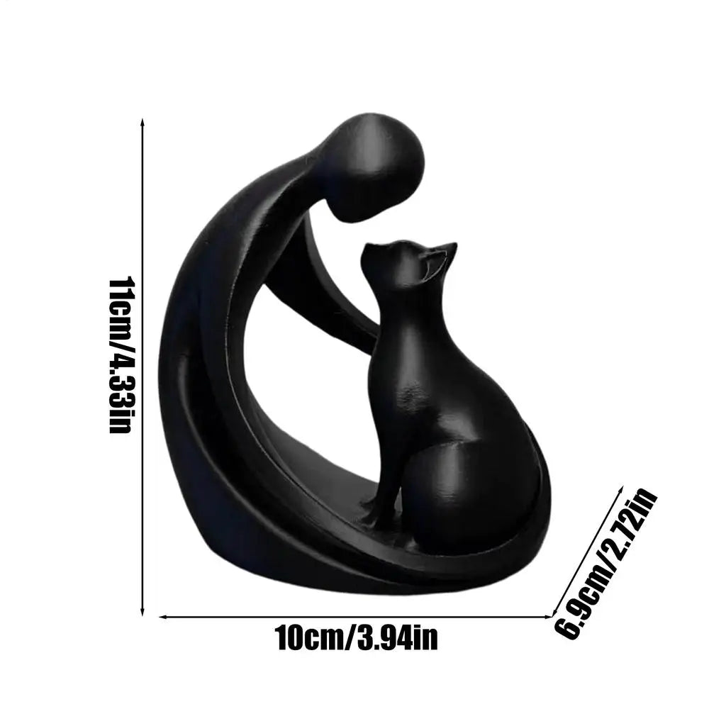 statuette moderne personne chat blanc noir stylisée abstraiteDecoration intérieure livre plante verte bougie chandelle