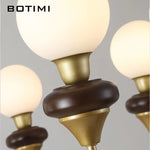 lustres modernes chandelier or marron foncé ampoules led globes opaques éléments décoratifs