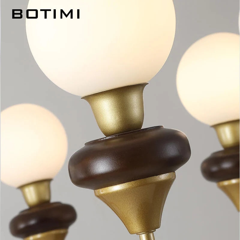 lustres modernes chandelier or marron foncé ampoules led globes opaques éléments décoratifs