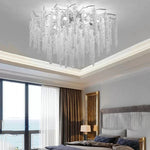 lustre moderne transparent branches goutte doré élégant illumination chambre salon