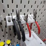 organiseur outils mural blanc noir rouge industriel panneau troué pince tournevis fixations