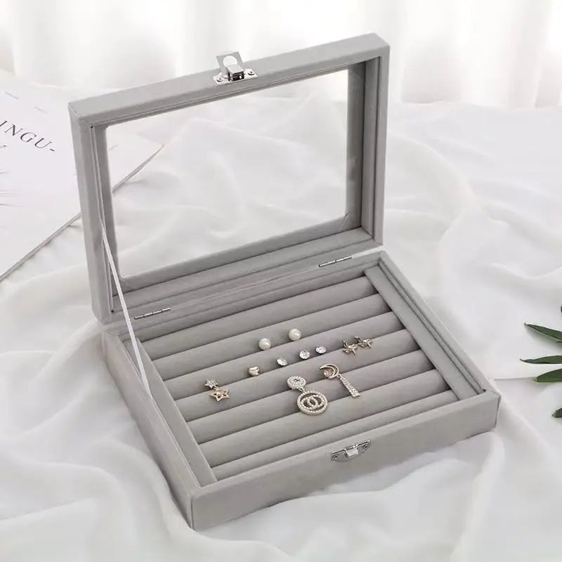 boîte bijoux velours miroir rangement bagues boucles d'oreilles poignées métal gris moderne sécurité protection