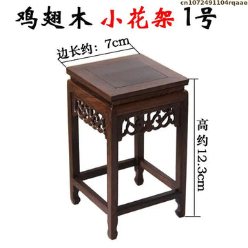 table bois foncée traditionnel gravures décoratives décoration vintage exposant figurines vases bonsaïs
