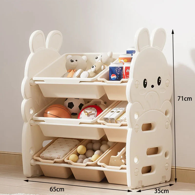 meuble rangement enfant moderne beige vert clair compartiments horloge cache lumière jouets divers plastique