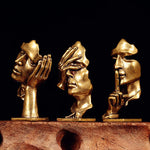 statuette abstraite dorée sculpture visage stylisé moderne décoration salon maison
