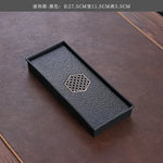 plateau thé noir insert doré traditionnel asiatique service table texture bois clair tasses théière