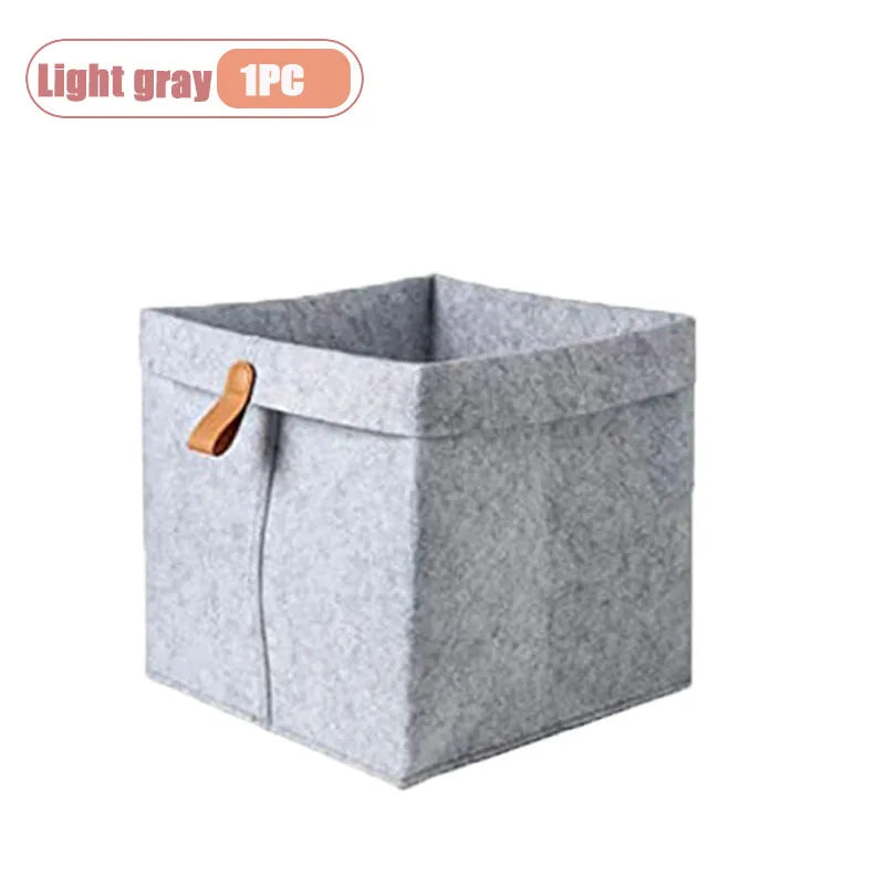 boîte rangement tissu veloutée gris clair foncée moderne pliable articles divers serviettes blanches broderie
