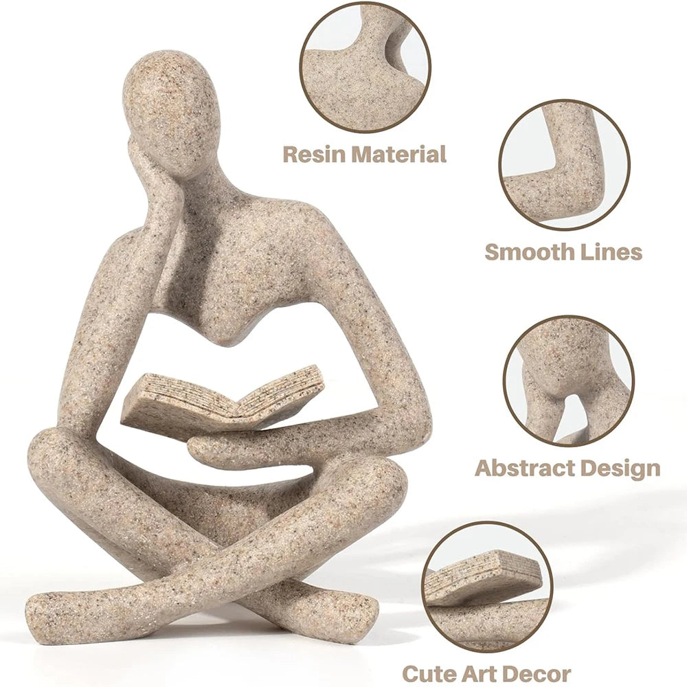 statue décorative résine figure humaine assise livre ouvert beige clair doré textures abstraites moderne